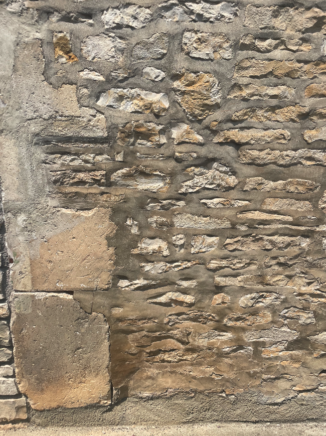 Muur van losse stenen, symboliseert het opbouwen van emotionele veerkracht en zelfregulatie.